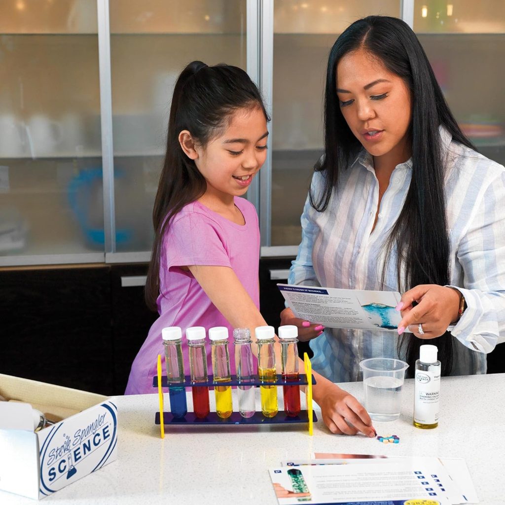 Child and mother conducting the experiments included in the STEM KIT: Amazing Scientist