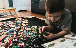 Child playing with building blocks. Building blocks are a great example of STEAM toy design