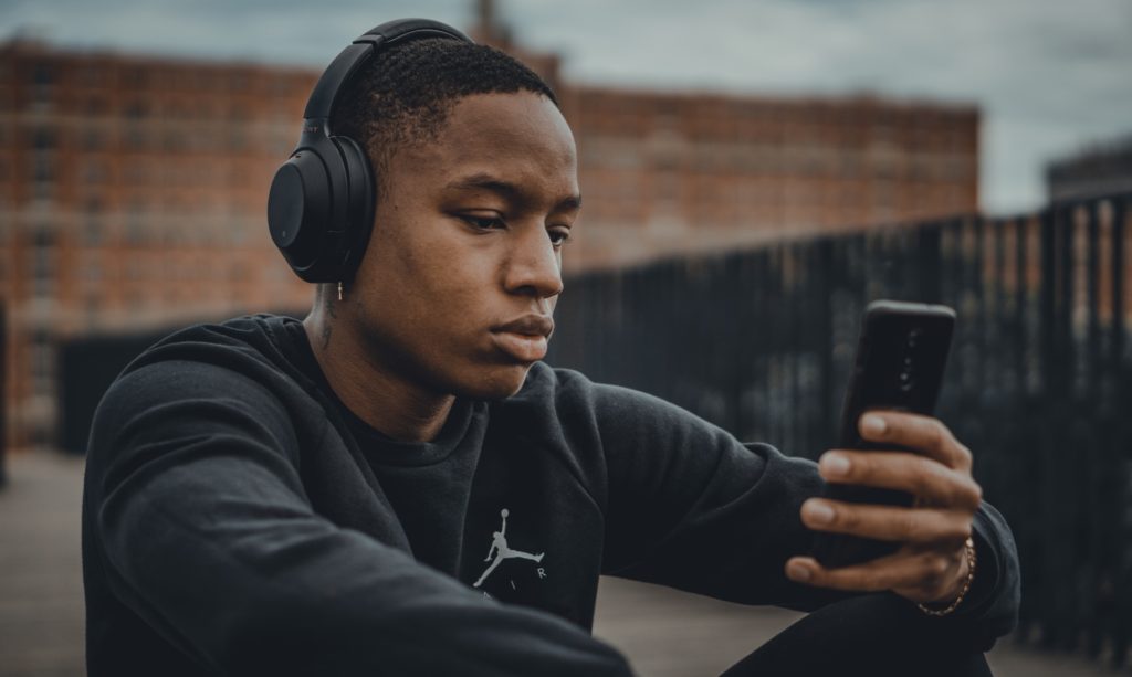 Man listening through his headphones